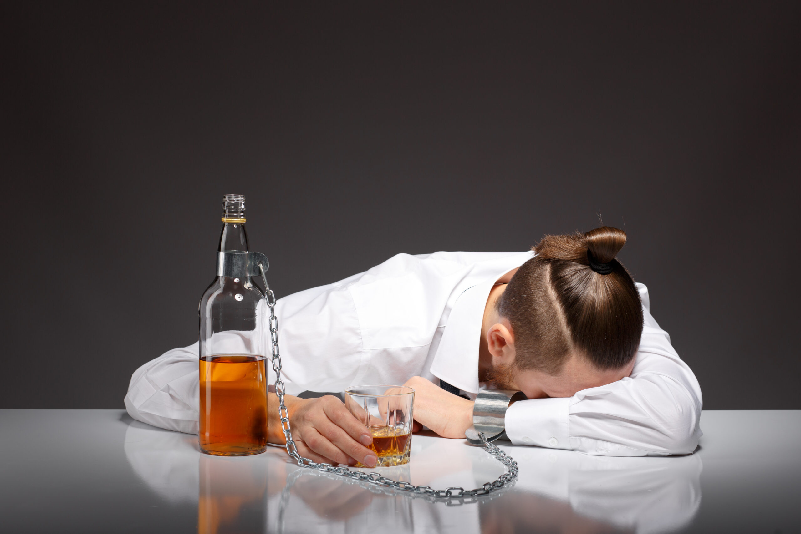 tired young businessman drinking